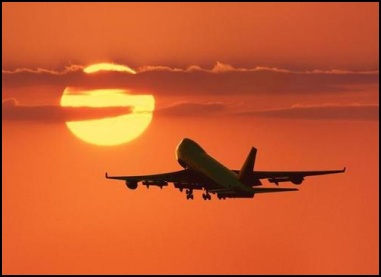 Aircraft in flight at sundown